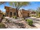 Charming southwestern home with desert landscaping, beautiful cacti and a well-maintained yard at 9653 E Sidewinder Trl, Scottsdale, AZ 85262