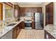 Modern kitchen with granite countertops, stainless steel appliances, and ample cabinet space at 9653 E Sidewinder Trl, Scottsdale, AZ 85262