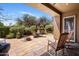 Relaxing outdoor patio with comfortable seating and lush desert landscape at 9653 E Sidewinder Trl, Scottsdale, AZ 85262