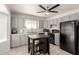 Functional kitchen with gray cabinets, black appliances, and tile flooring at 1029 E Marco Polo Rd, Phoenix, AZ 85024