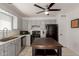 Clean kitchen with gray cabinets, black appliances, tile floors, and ample counter space at 1029 E Marco Polo Rd, Phoenix, AZ 85024