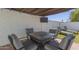 Outdoor patio with a seating area, a covered television, and lounge chairs for relaxation at 1029 E Marco Polo Rd, Phoenix, AZ 85024