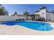 Backyard pool with a covered patio, well-maintained landscaping, and a grill at 1029 E Marco Polo Rd, Phoenix, AZ 85024