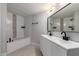 Bathroom featuring double sink, tub and shower combination at 1064 S 97Th St, Mesa, AZ 85208