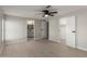 Spacious bedroom with ceiling fan, closet, and bathroom access at 1064 S 97Th St, Mesa, AZ 85208