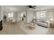 Bright, open living space with light hardwood floors, contemporary furnishings, and seamless flow to the dining area at 1064 S 97Th St, Mesa, AZ 85208