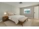 Calm bedroom with a comfortable bed, bench, and a large window providing natural light at 1064 S 97Th St, Mesa, AZ 85208