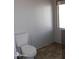 Bathroom features a toilet, small window and white paneling at 11596 W Sierra Dawn Blvd # 286, Surprise, AZ 85378