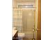 Modest bathroom features a shower-tub combo with a shower curtain and a toilet with a wooden vanity at 11596 W Sierra Dawn Blvd # 286, Surprise, AZ 85378