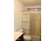 Modest bathroom features a shower-tub combo with a window and a toilet with a wooden vanity at 11596 W Sierra Dawn Blvd # 286, Surprise, AZ 85378