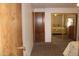 Bedroom features a mirrored closet, built in storage, and warm inviting carpet at 11596 W Sierra Dawn Blvd # 286, Surprise, AZ 85378