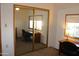 Comfortable bedroom with mirrored closet doors and ample space for furniture at 11596 W Sierra Dawn Blvd # 286, Surprise, AZ 85378