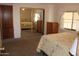Comfortable bedroom featuring a mirrored closet and natural light, with ample space for storage at 11596 W Sierra Dawn Blvd # 286, Surprise, AZ 85378