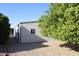 Side yard featuring desert landscaping and lush mature orange tree at 11596 W Sierra Dawn Blvd # 286, Surprise, AZ 85378