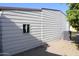 Side yard featuring desert landscaping with lush mature orange tree at 11596 W Sierra Dawn Blvd # 286, Surprise, AZ 85378