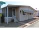 Charming single-story home featuring a cozy porch and well-maintained landscaping at 11596 W Sierra Dawn Blvd # 286, Surprise, AZ 85378
