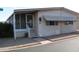Charming home with a welcoming screened-in porch and well-maintained gravel landscaping at 11596 W Sierra Dawn Blvd # 286, Surprise, AZ 85378