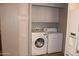 Convenient laundry room with modern washer and dryer units and storage cabinets at 11596 W Sierra Dawn Blvd # 286, Surprise, AZ 85378