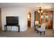 Open-concept living room featuring a dining area and entertainment space at 11596 W Sierra Dawn Blvd # 286, Surprise, AZ 85378