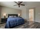 Bedroom featuring dark wood floors, ceiling fan, natural light, and a bed at 1197 W Fir Tree Rd, Queen Creek, AZ 85140