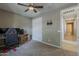 Spacious bedroom with carpet flooring, ceiling fan, and a TV mount at 1197 W Fir Tree Rd, Queen Creek, AZ 85140