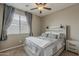 Cozy bedroom featuring a ceiling fan, natural light, and neutral tones for a calming ambiance at 1197 W Fir Tree Rd, Queen Creek, AZ 85140