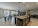 Open-concept kitchen featuring a large island, granite countertops, and stainless steel appliances at 1197 W Fir Tree Rd, Queen Creek, AZ 85140