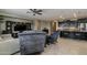 Living room view featuring comfortable seating, stylish decor, and an open layout to the kitchen at 1197 W Fir Tree Rd, Queen Creek, AZ 85140