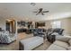 Open-concept interior showcases tile floors, a ceiling fan, and seamless flow into the kitchen at 1197 W Fir Tree Rd, Queen Creek, AZ 85140