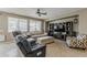 Comfortable living room showcases entertainment center, ceiling fan and neutral walls at 1197 W Fir Tree Rd, Queen Creek, AZ 85140