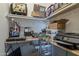 Office space features organized shelving and desk with storage for office supplies at 1197 W Fir Tree Rd, Queen Creek, AZ 85140