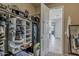 Organized walk-in closet with shelves, hanging storage, and a safe for valuables inside a home at 1197 W Fir Tree Rd, Queen Creek, AZ 85140