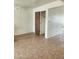 Bright bedroom with tile flooring and closet at 124 S Cottonwood St, Chandler, AZ 85225