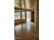 Bonus room featuring ceramic tile flooring, a ceiling fan and outdoor access at 124 S Cottonwood St, Chandler, AZ 85225