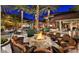 Inviting outdoor fire pit with comfortable seating, perfect for gatherings and relaxation at 13051 W Black Hill Rd, Peoria, AZ 85383