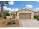 Charming single-story home with a well-manicured yard and a two-car garage at 13051 W Black Hill Rd, Peoria, AZ 85383