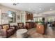 Well-appointed kitchen with wood cabinets, granite counters, and comfortable seating area, perfect for relaxing and entertaining at 13051 W Black Hill Rd, Peoria, AZ 85383