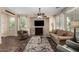 Inviting living room featuring a ceiling fan, TV, plush seating, and a stylish rug, ideal for comfortable living at 13051 W Black Hill Rd, Peoria, AZ 85383