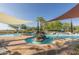 Resort-style outdoor pool with sun shades and a central waterfall feature, ideal for relaxation and recreation at 13051 W Black Hill Rd, Peoria, AZ 85383