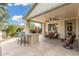 Covered patio with built in grill and bar, and ample seating at 13051 W Black Hill Rd, Peoria, AZ 85383