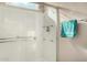 Modern shower featuring sleek glass enclosure, multiple shower heads, and convenient grab bar for enhanced safety and comfort at 13051 W Black Hill Rd, Peoria, AZ 85383