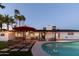 Inviting backyard with a sparkling pool, charming patio and lounge area, perfect for relaxation and entertaining at 1307 E Encanto St, Mesa, AZ 85203