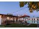 Backyard with string lights, outdoor dining, and a pool, perfect for outdoor entertaining at 1307 E Encanto St, Mesa, AZ 85203