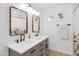 Bright bathroom with double vanity, decorative mirrors, and modern fixtures at 1307 E Encanto St, Mesa, AZ 85203