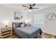 Cozy bedroom with wood floors, queen bed, and stylish bedside tables with lamps at 1307 E Encanto St, Mesa, AZ 85203