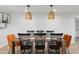 Dining room boasts modern lighting, stylish furniture, and a neutral color palette at 1307 E Encanto St, Mesa, AZ 85203