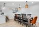 Beautiful dining room featuring a wood table, stylish seating, and decorative pendant lights at 1307 E Encanto St, Mesa, AZ 85203