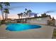 Stunning pool with palm trees and a covered patio perfect for entertaining guests at 1307 E Encanto St, Mesa, AZ 85203