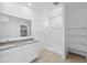Spacious bathroom with dual sinks, granite countertops, and a walk-in shower at 1331 W Hess Ave, Coolidge, AZ 85128