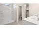 A clean and well-lit bathroom offers a convenient walk-in shower and double vanity at 1343 W Hess Ave, Coolidge, AZ 85128